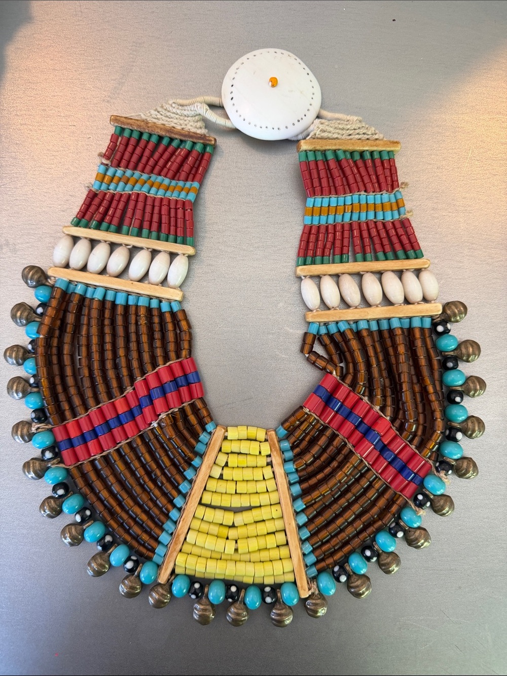 Multi-strand Vintage Naga tribal beaded bib necklace with brass bells.